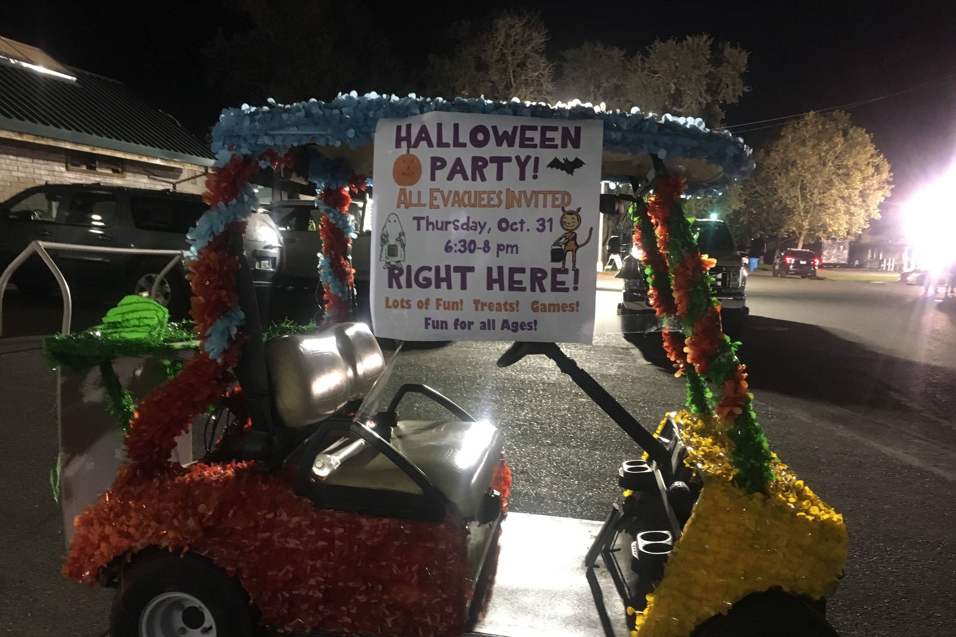 A golf cart greets evacuees at a Halloween party at a shelter at the Sonoma County Fairgrounds.