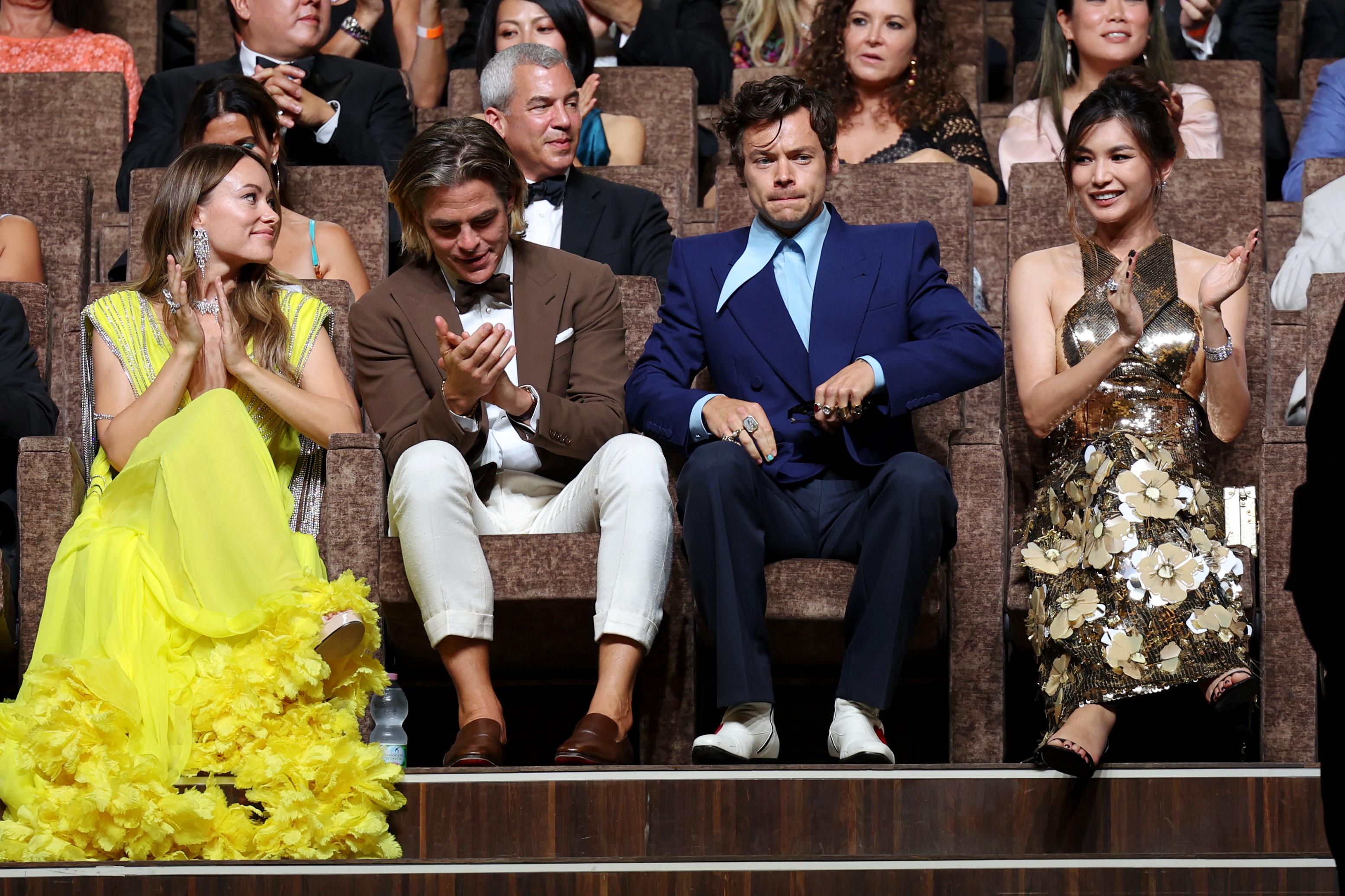 Olivia Wilde, Chris Pine, Harry Styles, and Gemma Chan seated in the audience at a screening at the Venice Film Festival.