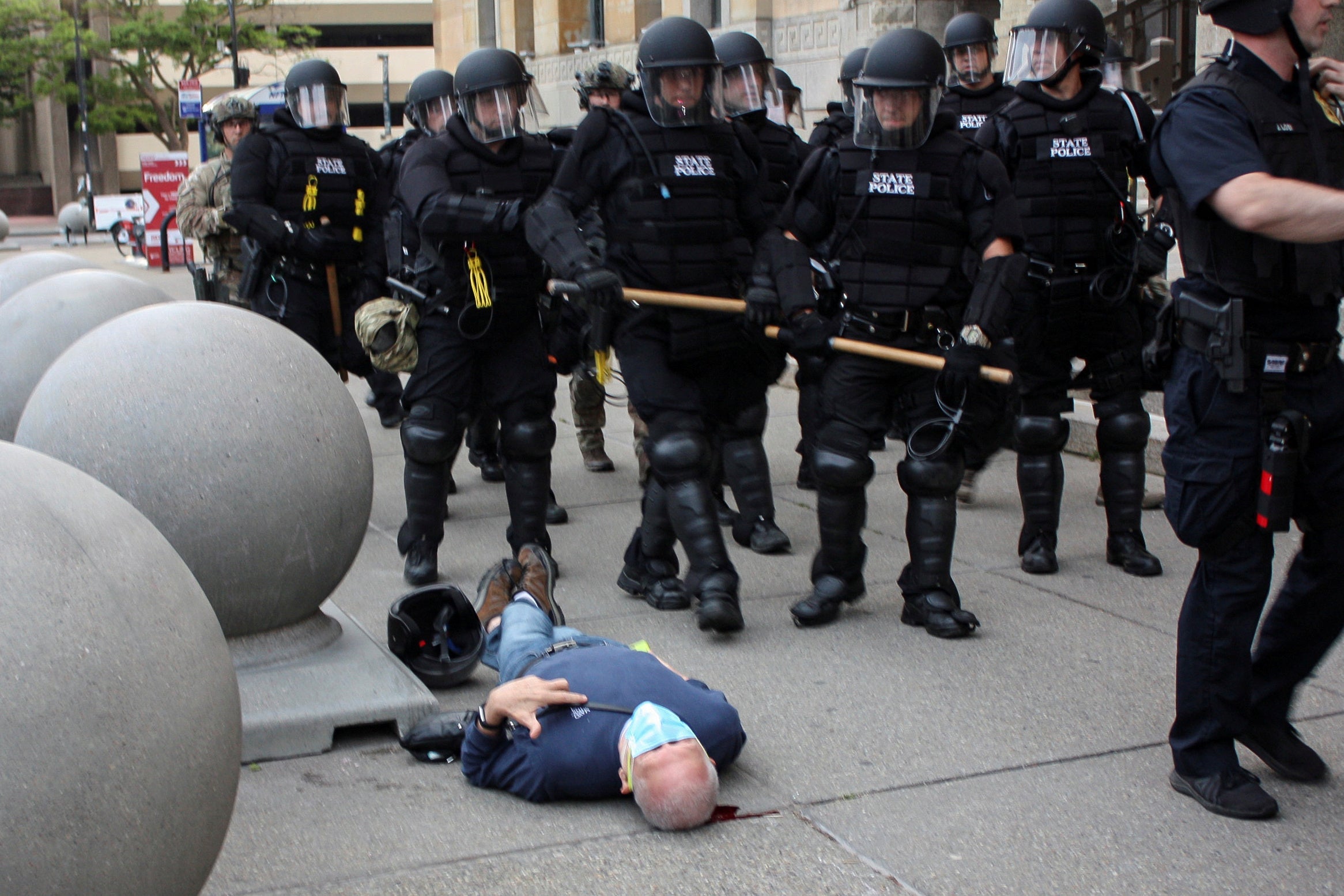 Martin Gugino, a 75-year-old protester, lays on the ground after he was shoved by two Buffalo, New York, police officers during a protest against the death in Minneapolis police custody of George Floyd in Niagara Square in Buffalo, New York, on June 4, 2020. 