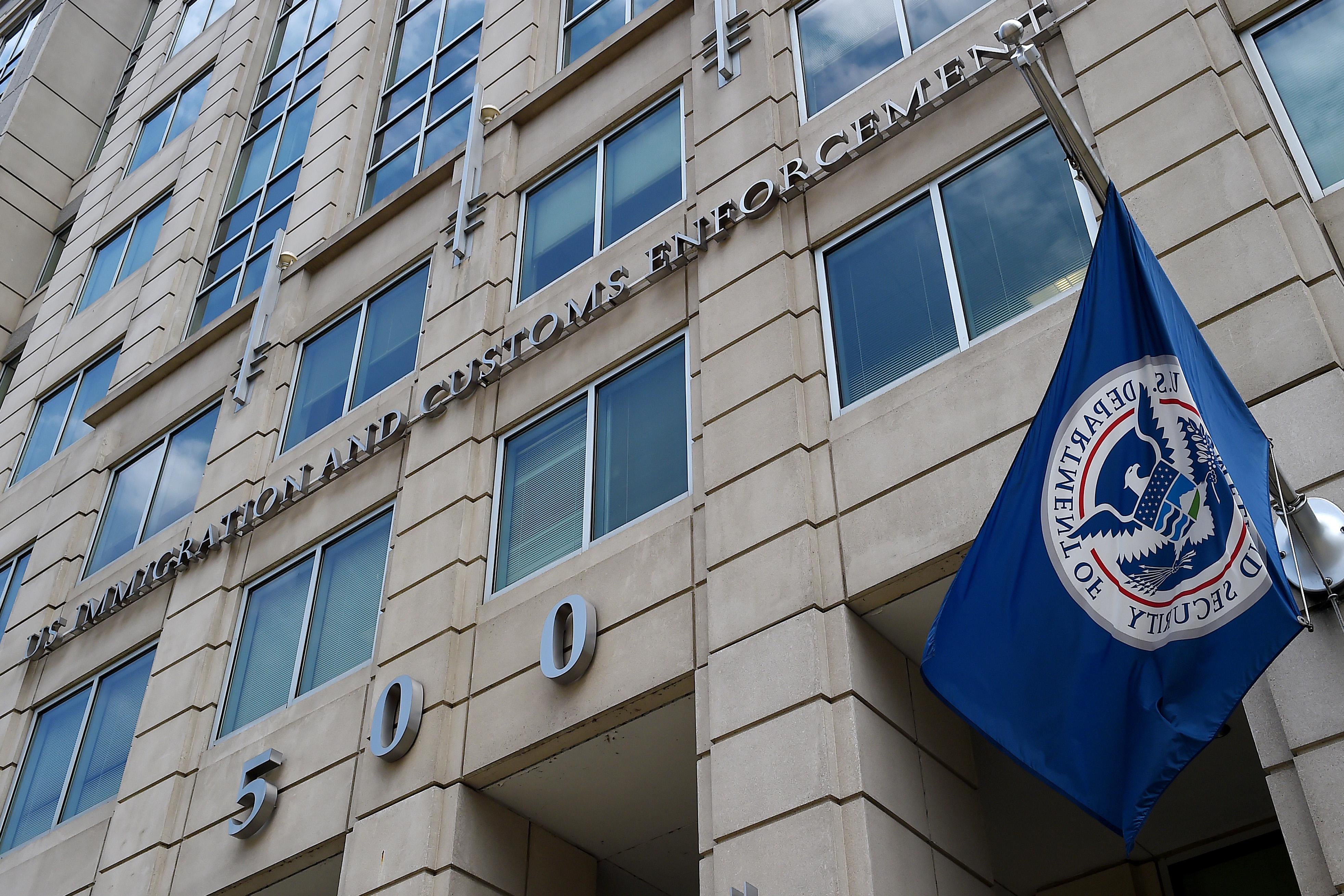 The Department of Homeland Security flag flies on the exterior of the Immigration and Customs Enforcement building
