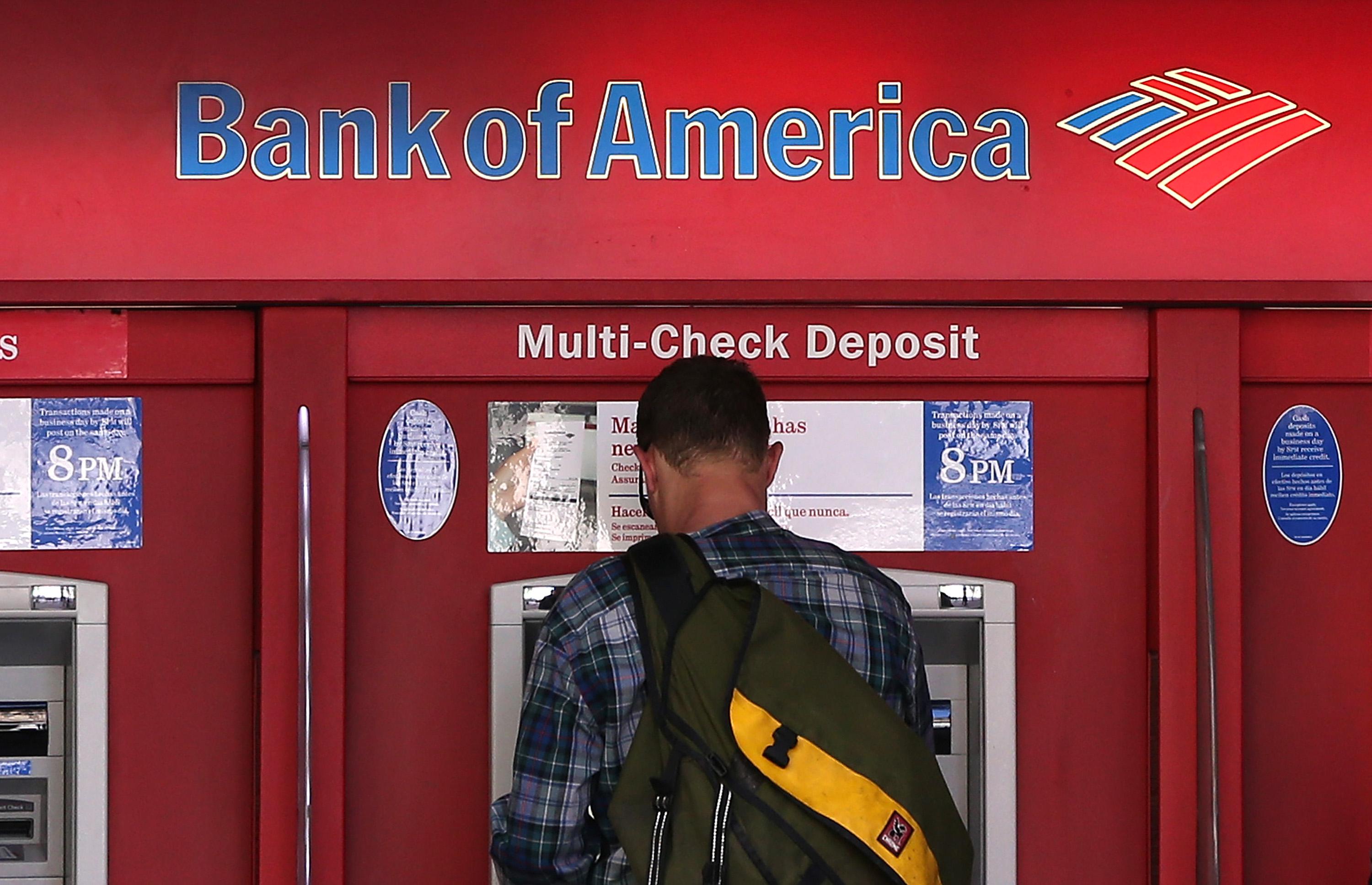 A man uses an ATM in San Francisco.