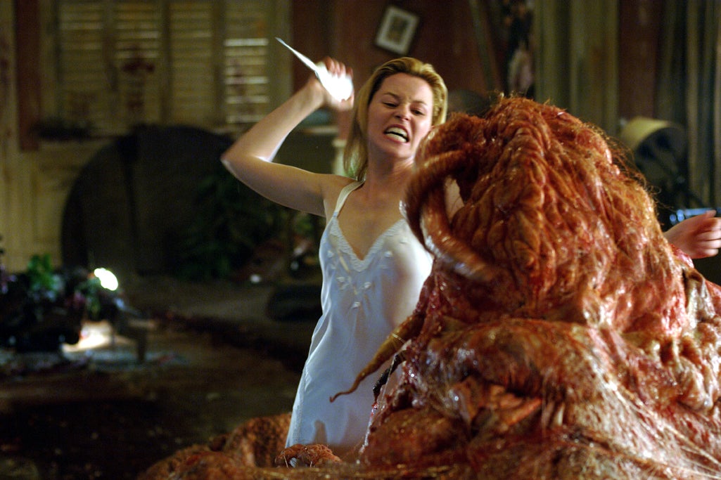 Elizabeth Banks stabs a monster in Slither. 