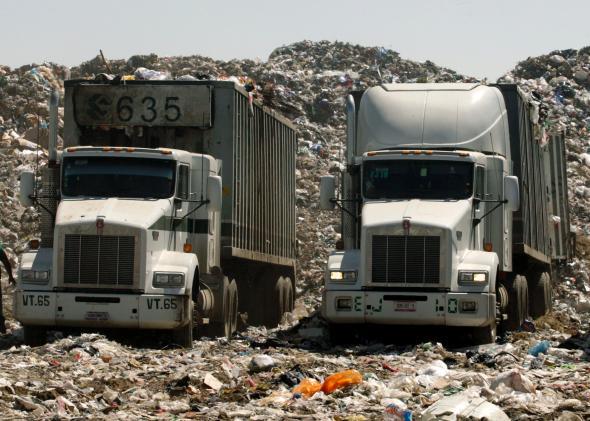 DATE IMPORTED: February 12, 2009 Trucks with garbage are parked at the Nezahualcoyotl dump site in Mexico City February 6, 2009. 