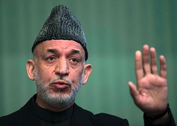 Afghan President Hamid Karzai addresses a press conference at the Presidential Palace in Kabul on January 25, 2014. 