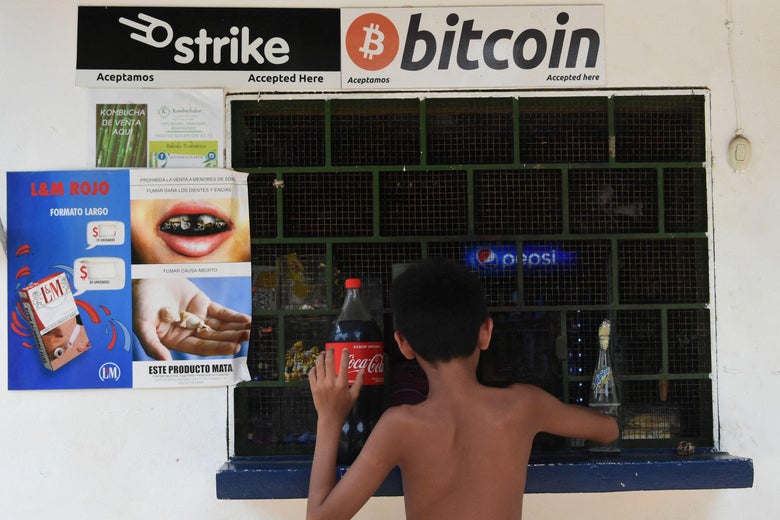 A man buys soda in a store that accepts Bitcoins in El Zonte.