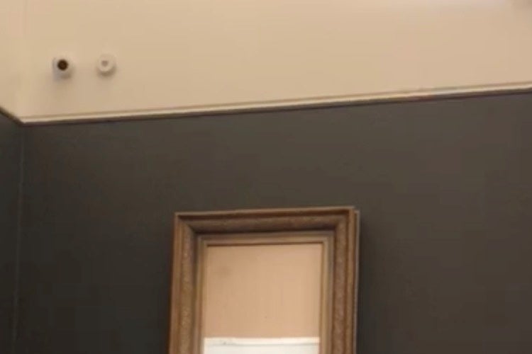 Banksy's painting "Girl with Red Balloon" is seen shredded after its sale at Sotheby's auction in London on October 5, 2018 in this still image taken from a video obtained from social media on October 6, 2018. 