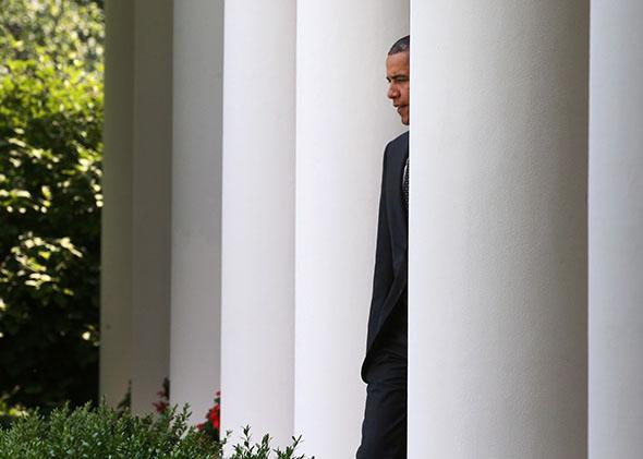U.S. President Barack Obama walks into the Rose Garden at the White House.