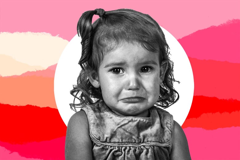 A toddler girl cries.