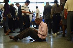 Job seekers at a job fair in Los Angeles, CA on May 31, 2012.