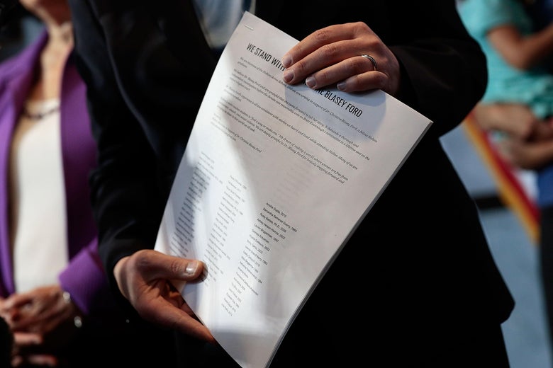 Kirsten Gillibrand holds a letter signed by Holton-Arms alumni in support of Christine Blasey Ford.