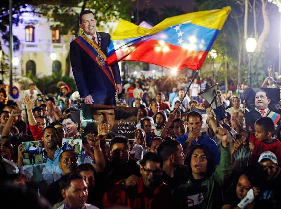 Supporters of Venezuela's President Hugo Chavez react to the announcement of his death in Caracas, March 5, 2013. 