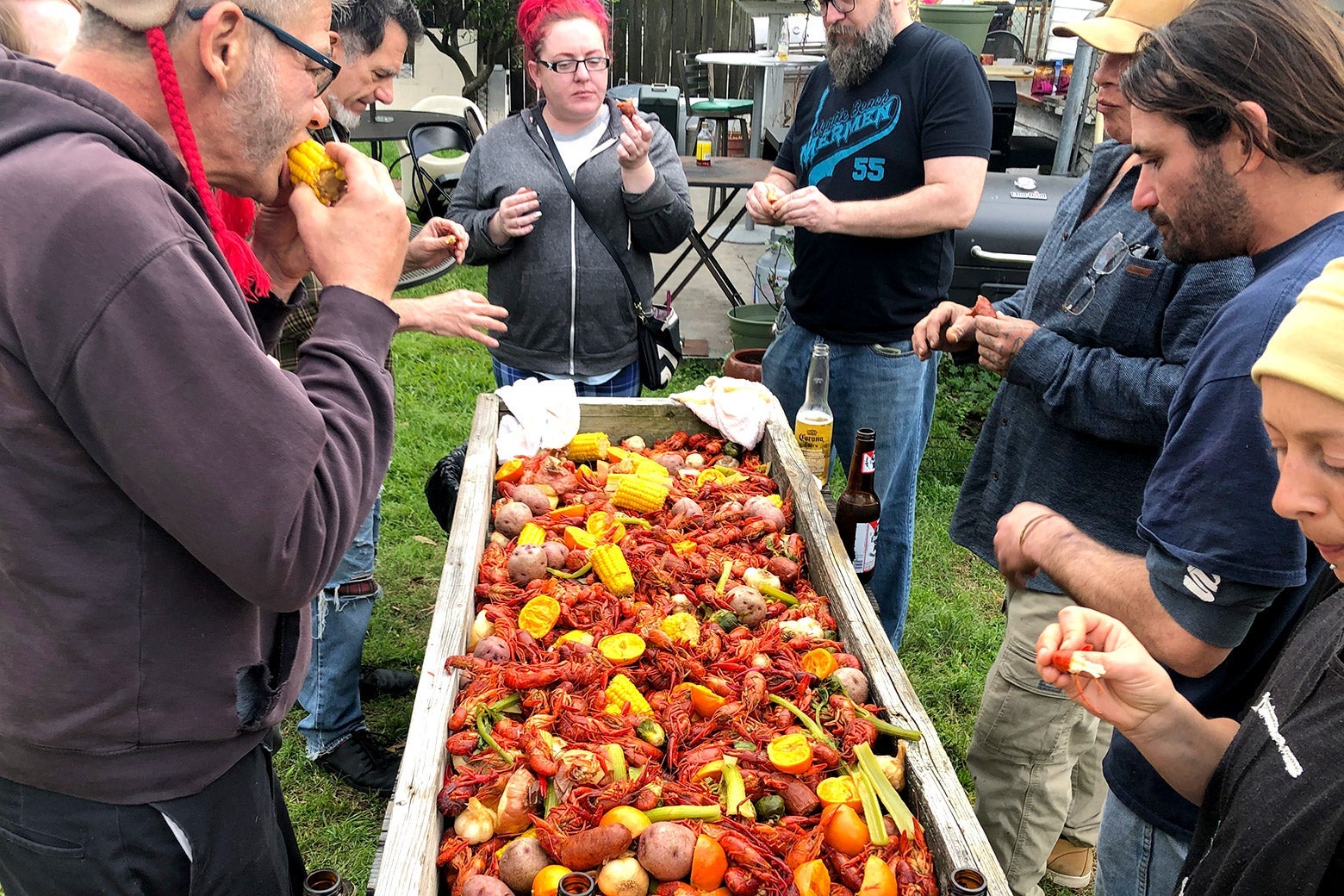 A group of people enjoying a crawfish boil.