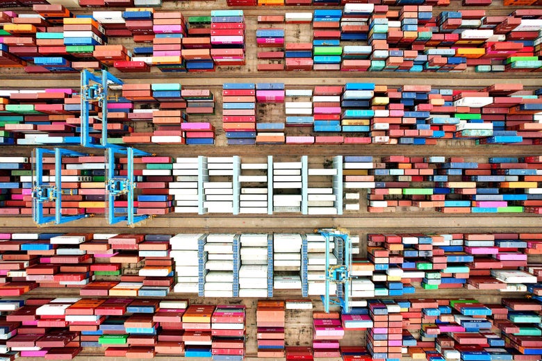 This aerial photo shows cargo containers stacked at a port in Qingdao, in China's eastern Shandong province on June 9, 2022. - - China OUT (Photo by AFP) / China OUT (Photo by STR/AFP via Getty Images)