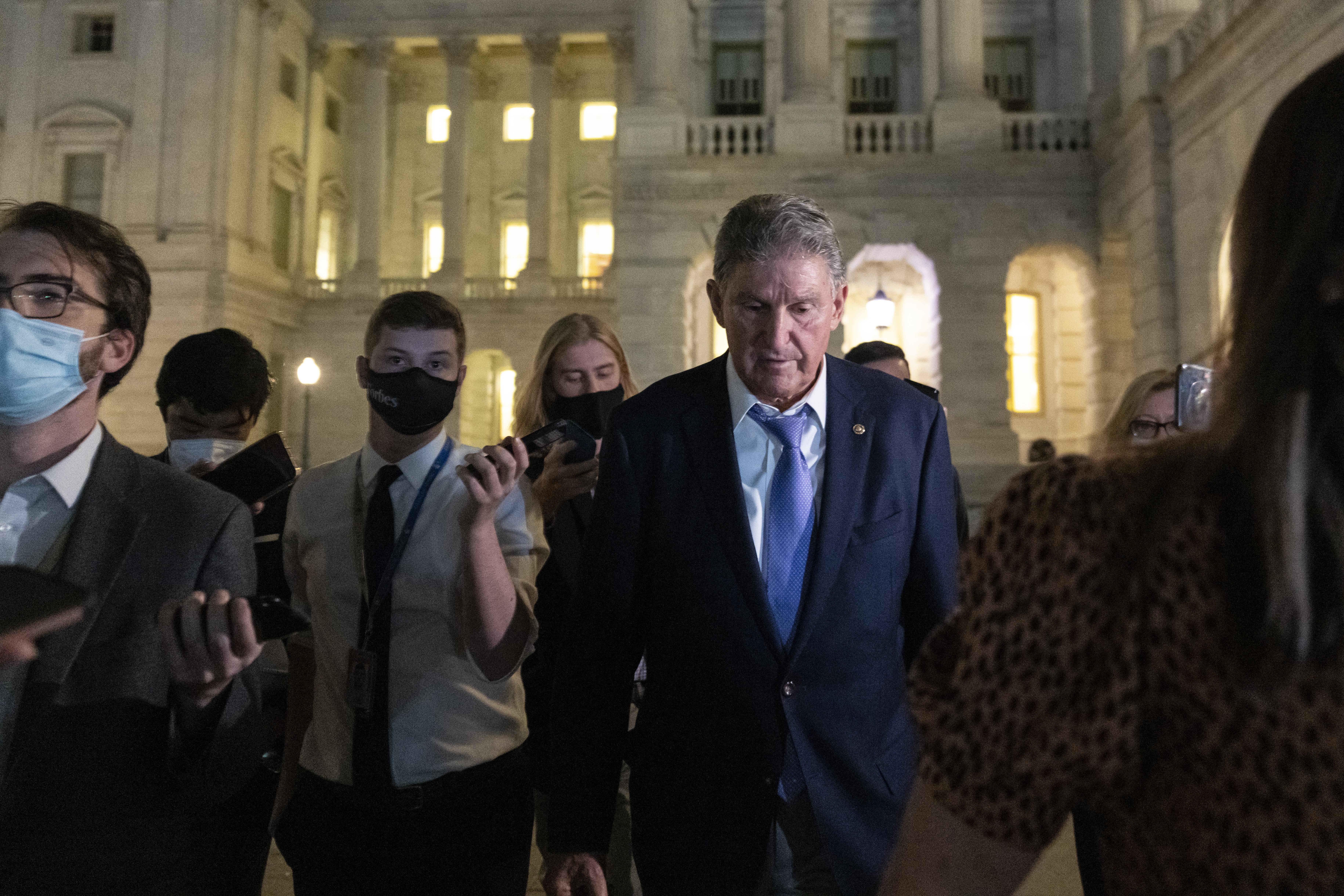 WASHINGTON, DC - SEPTEMBER 30: Sen. Joe Manchin (D-WV) exits the U.S. Capitol after meeting with White House officials September 30, 2021 in Washington, DC. Manchin has stated that he will not support a social policy spending package that goes over $1.5 trillion, at odds with the $3.5 trillion package supported by more liberal Democrats. (Photo by Drew Angerer/Getty Images)