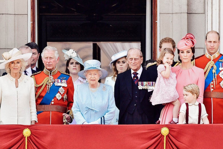 Members of the royal family stand together on a balcony.