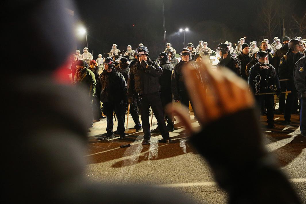 Police confront demonstrators during a protest on Nov. 25, 2014, in Ferguson, Missouri