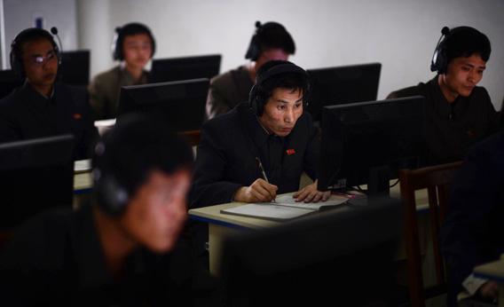 A North Korean worker checks a computer at the control room of a textile factory in Pyongyang in April 2012. 