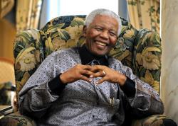 Former president of South Africa Nelson Mandela chats with Britain's Prime Minister Gordon Brown (unseen) during a meeting at his hotel in central London June 24, 2008.