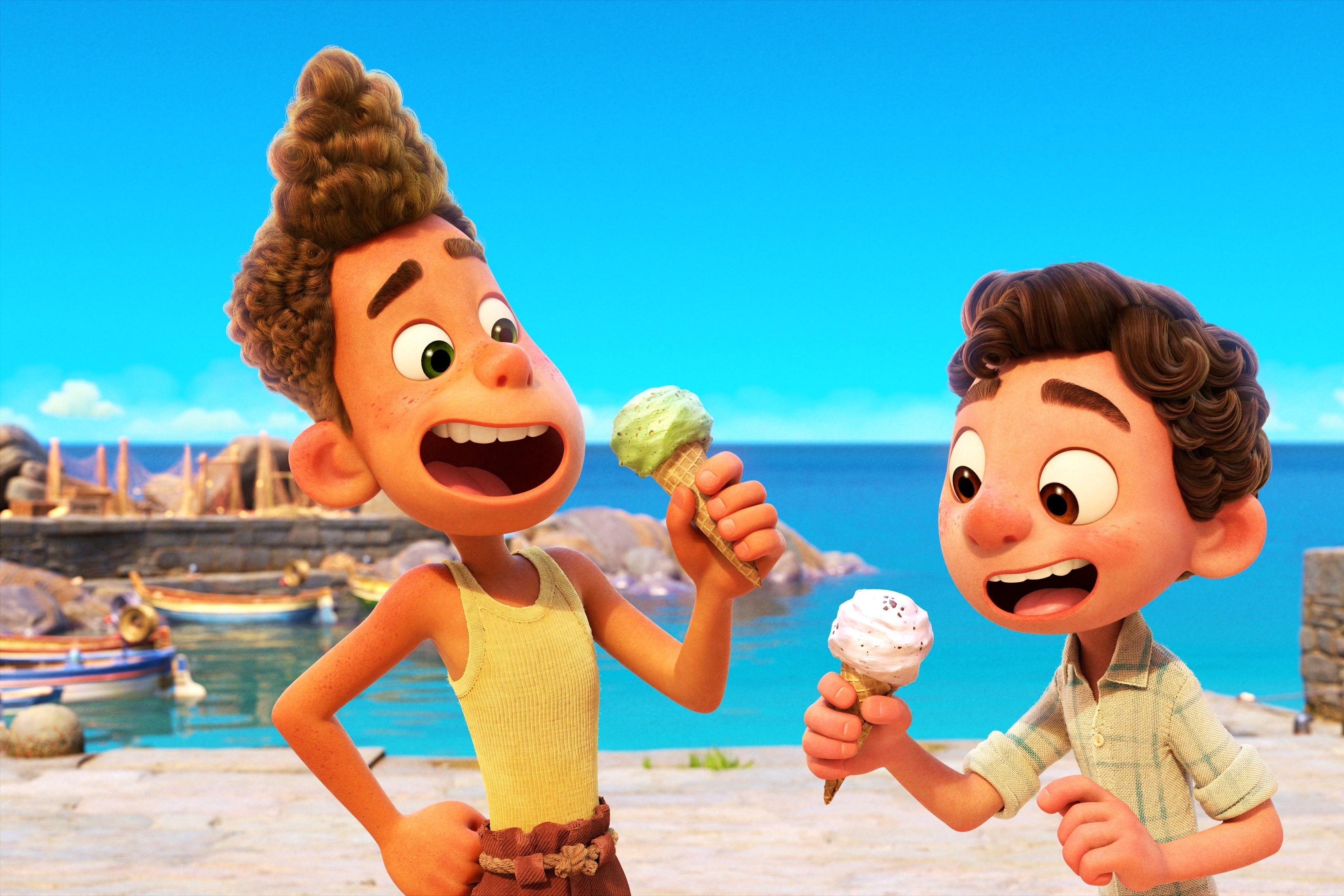 Two cute, big-eyed boys with curly hair eat ice cream on the picturesque Italian coast.