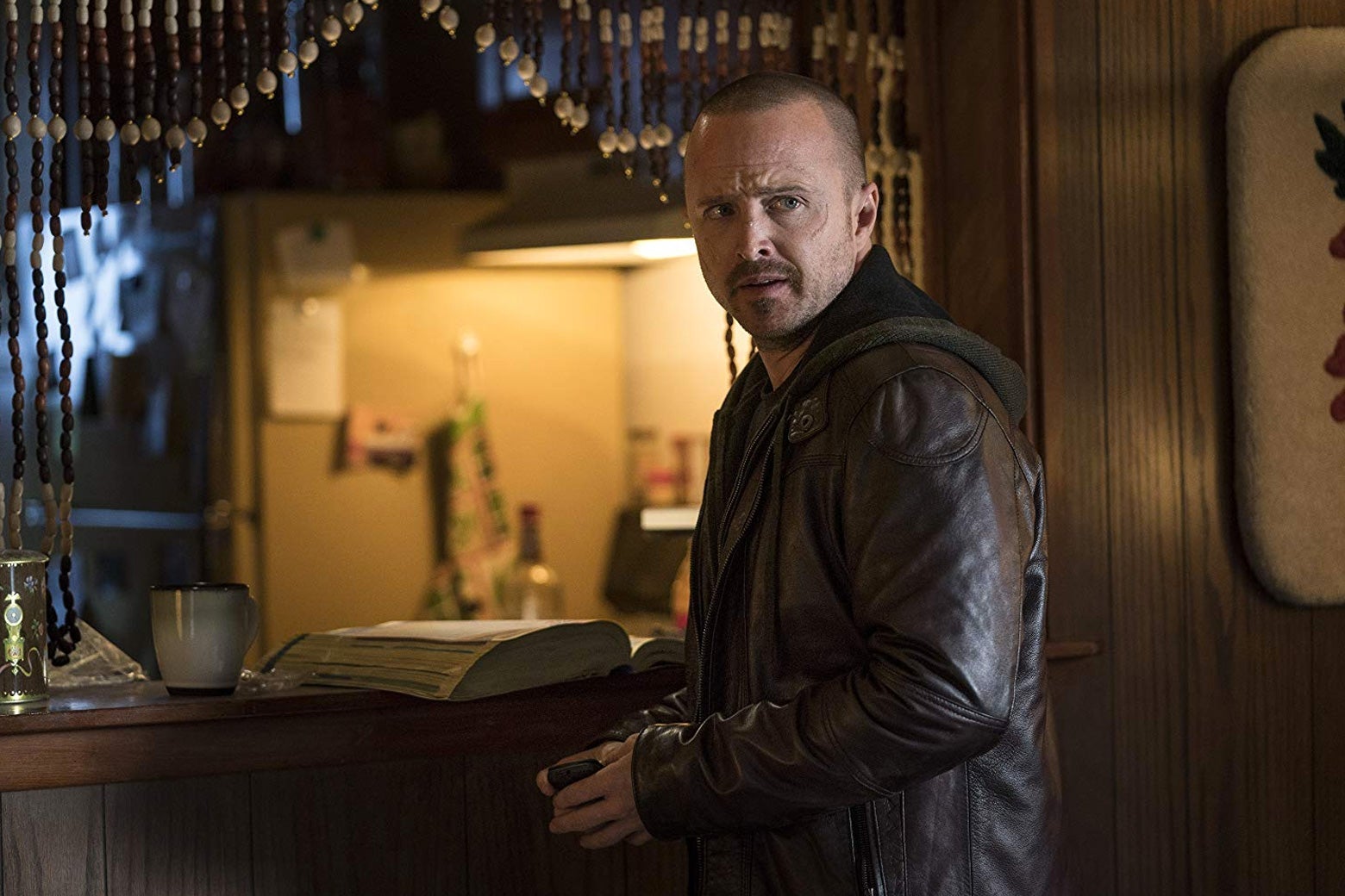Aaron Paul wears a leather jacket in a still from El Camino.