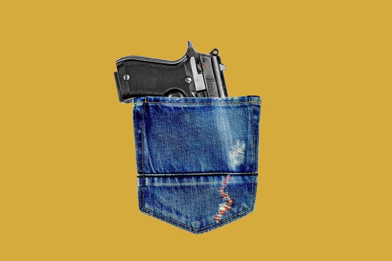 A handgun nestled in a denim pocket