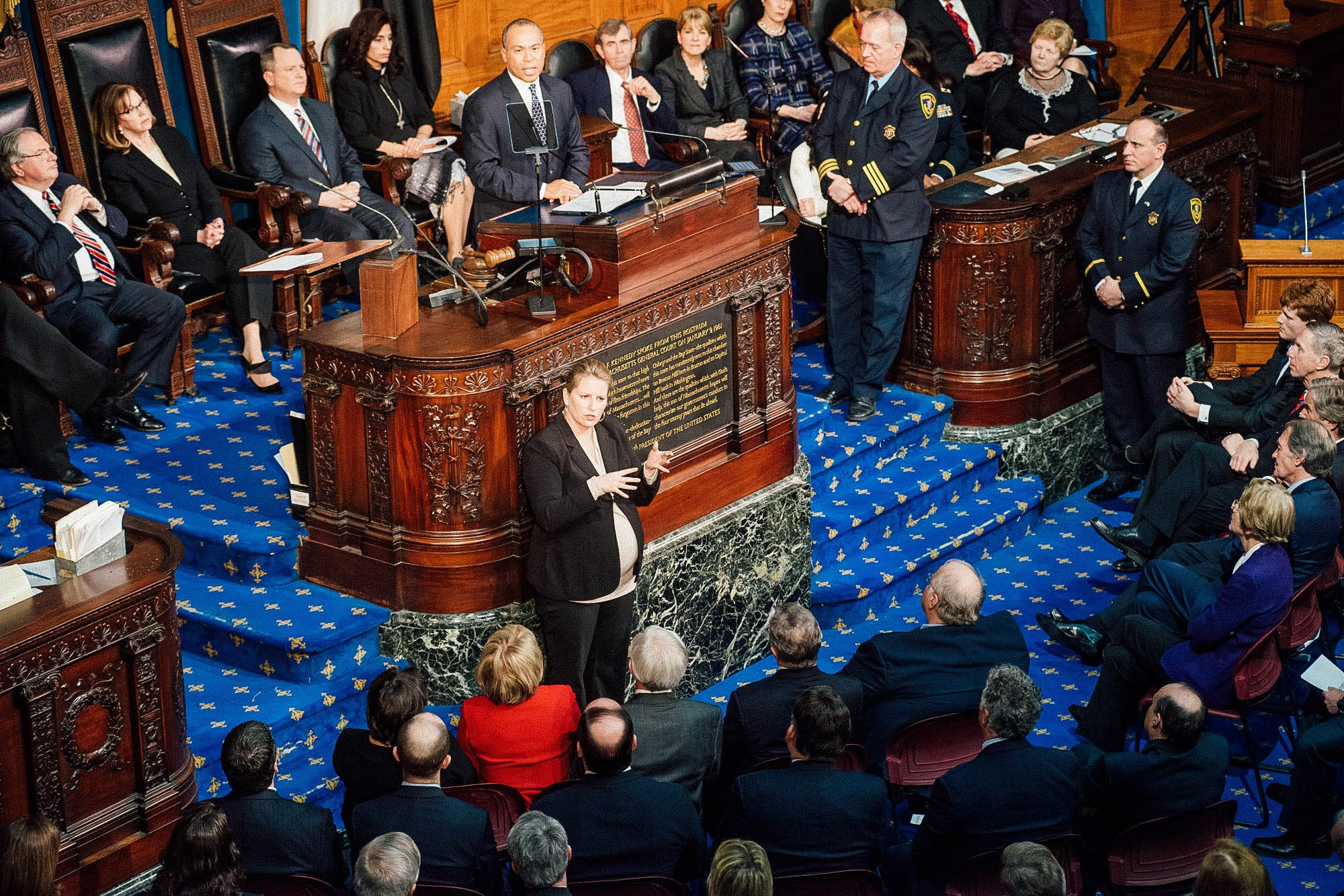 Anna signs on the floor of the state Legislature.