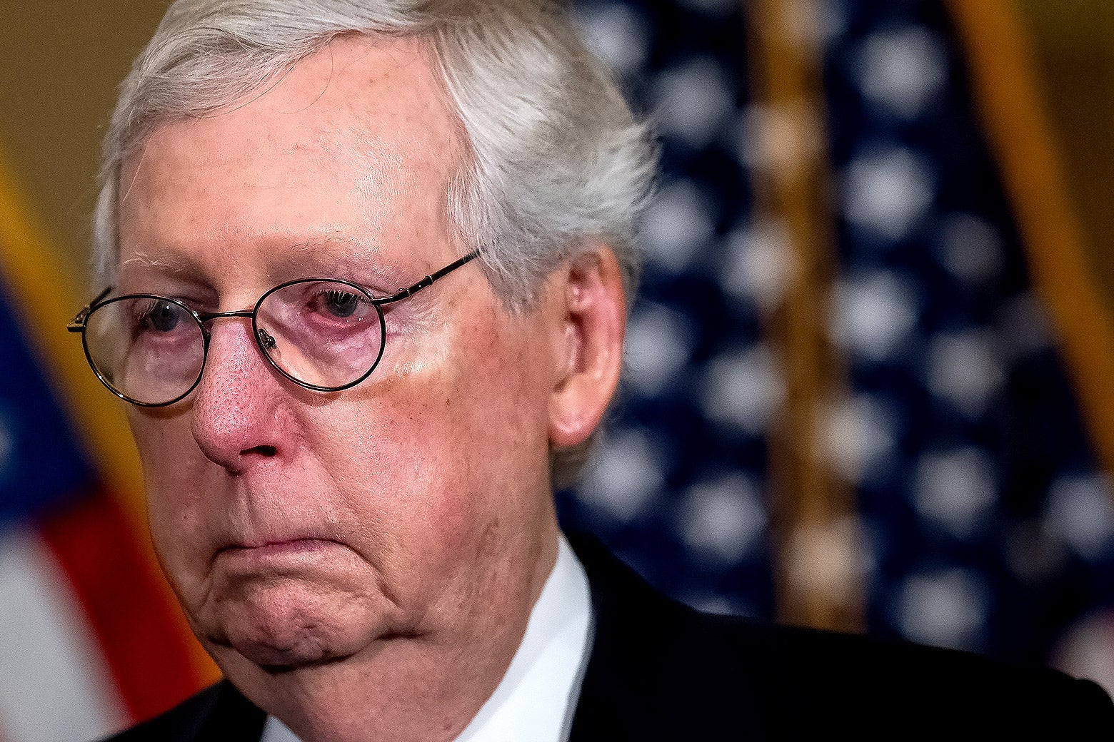 A sullen looking Mitch McConnell.