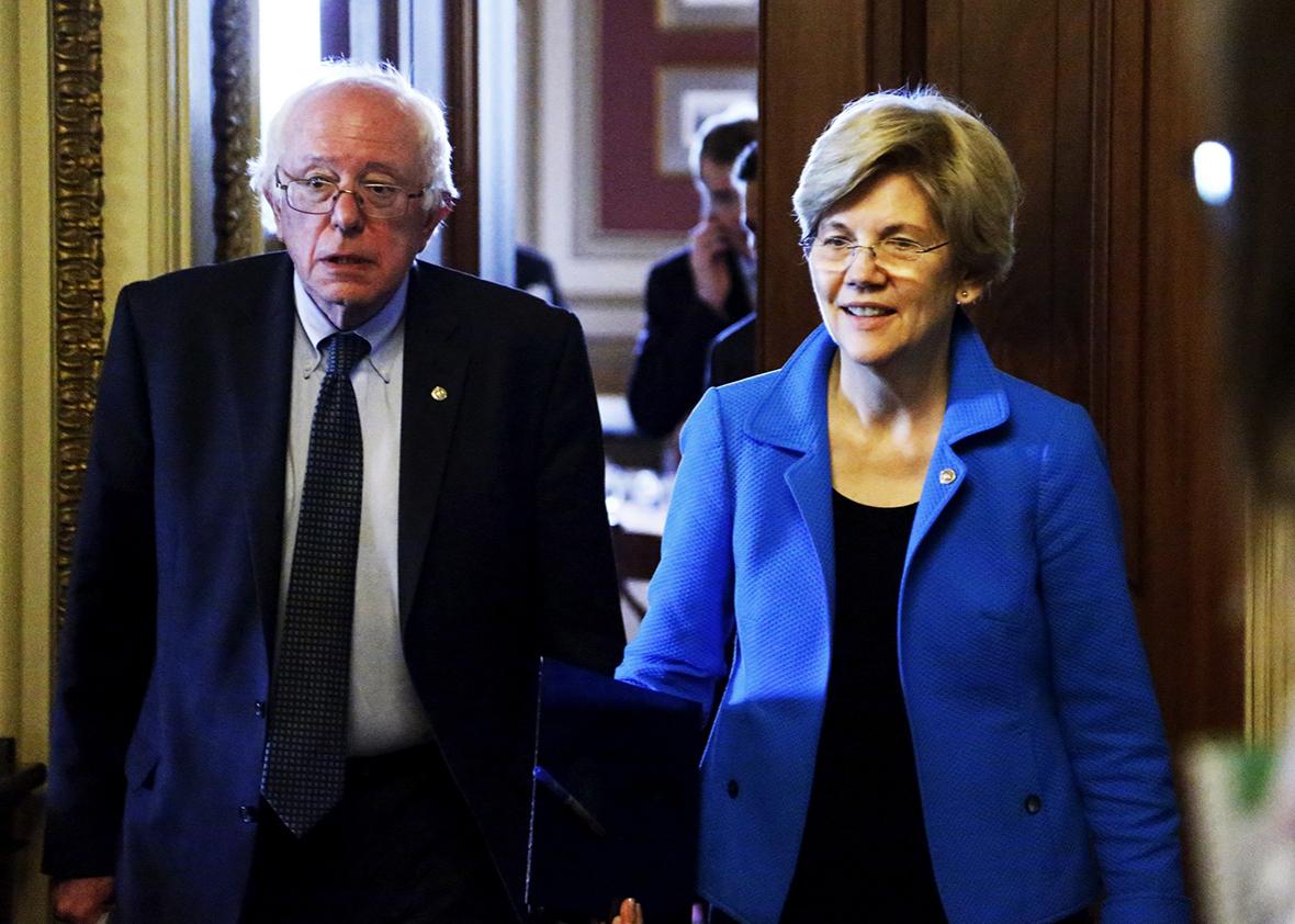U.S. Senators Bernie Sanders and Elizabeth Warren walk to the Senate floor after the weekly Democratic caucus policy luncheon at the U.S. Capitol in Washington May 12, 2015.  