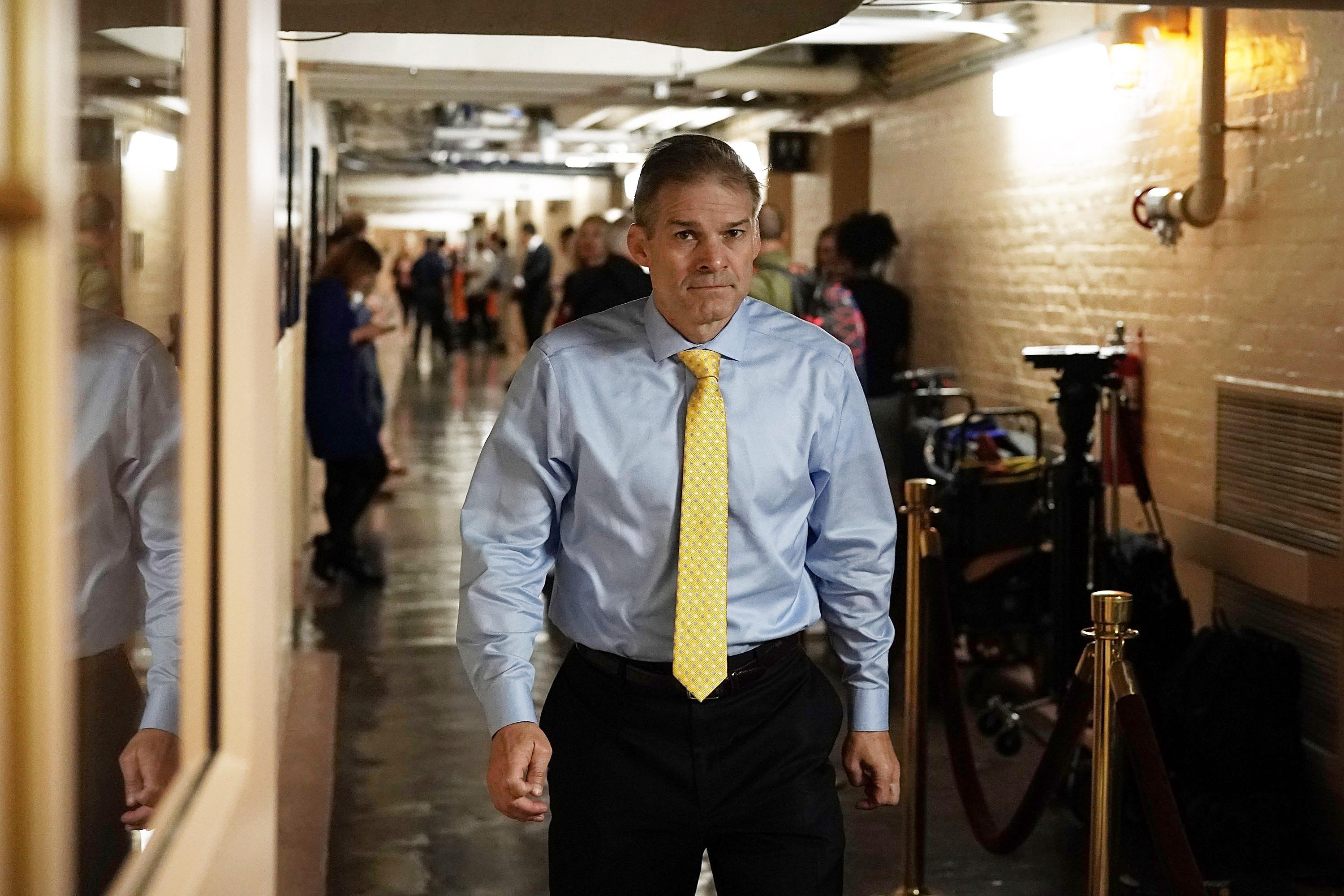 Jim Jordan walks down a hall on Capitol Hill.