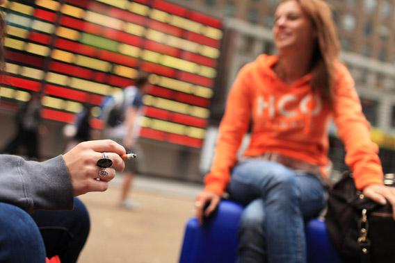Women smoke in a Times Square pedestrian island on September 16, 2010 in New York City.