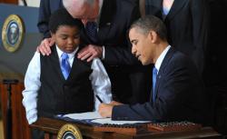 US President Barack Obama signs the health insurance reform bill.
