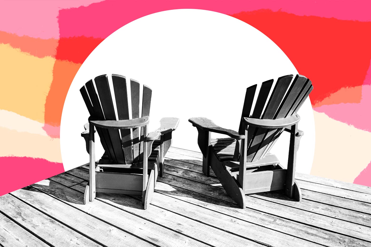 Two deck chairs sitting next to each other
