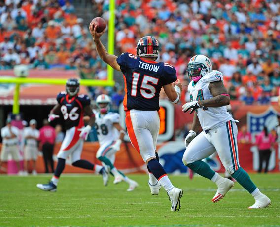 Tim Tebow #15 of the Denver Broncos passes against the Miami Dolphins.