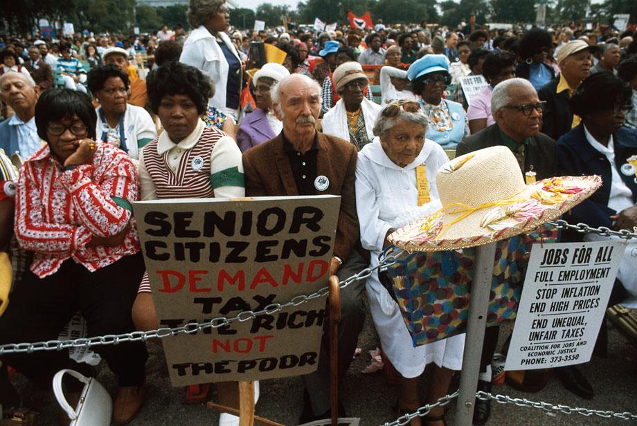 A senior citizens march to protest inflation, unemployment and high taxes stopped along Lake Shore Drive in Chicago to hear speeches from various officials. The rally was headed by the Rev. Jesse Jackson and Operation Push.” John H. White, Chicago, Illinois, October 1973