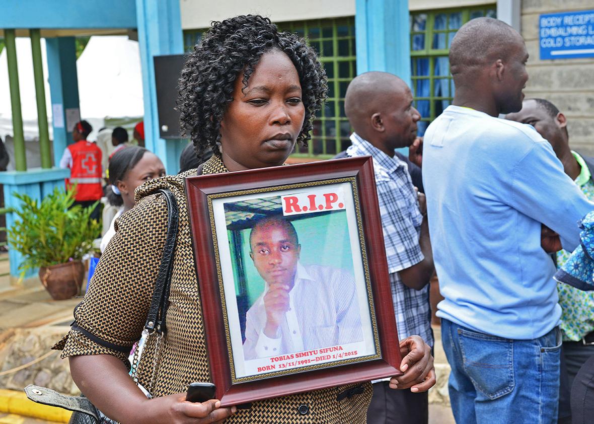 A women holds the portrait of Garissa terrorist attack victim Tobias Simiyu Sifuna at Chiromo morgue in Nairobi on April, 9,2015. 