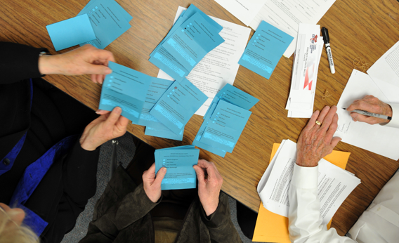  Volunteers count ballots from voters during a Republican caucus at Becker Middle School February 4, 2012 in Las Vegas, Nevada. 