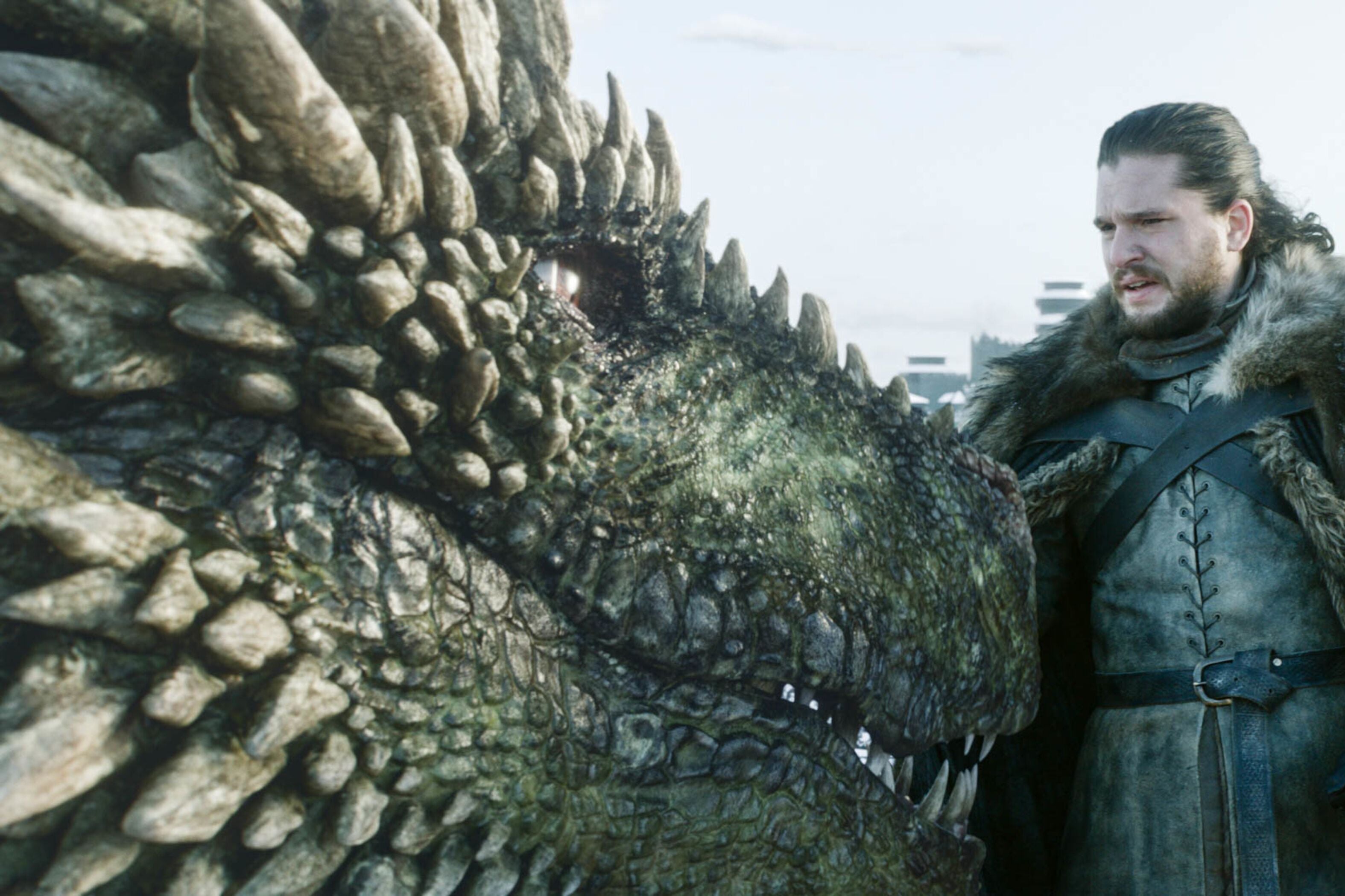 Jon Snow pets a dragon.