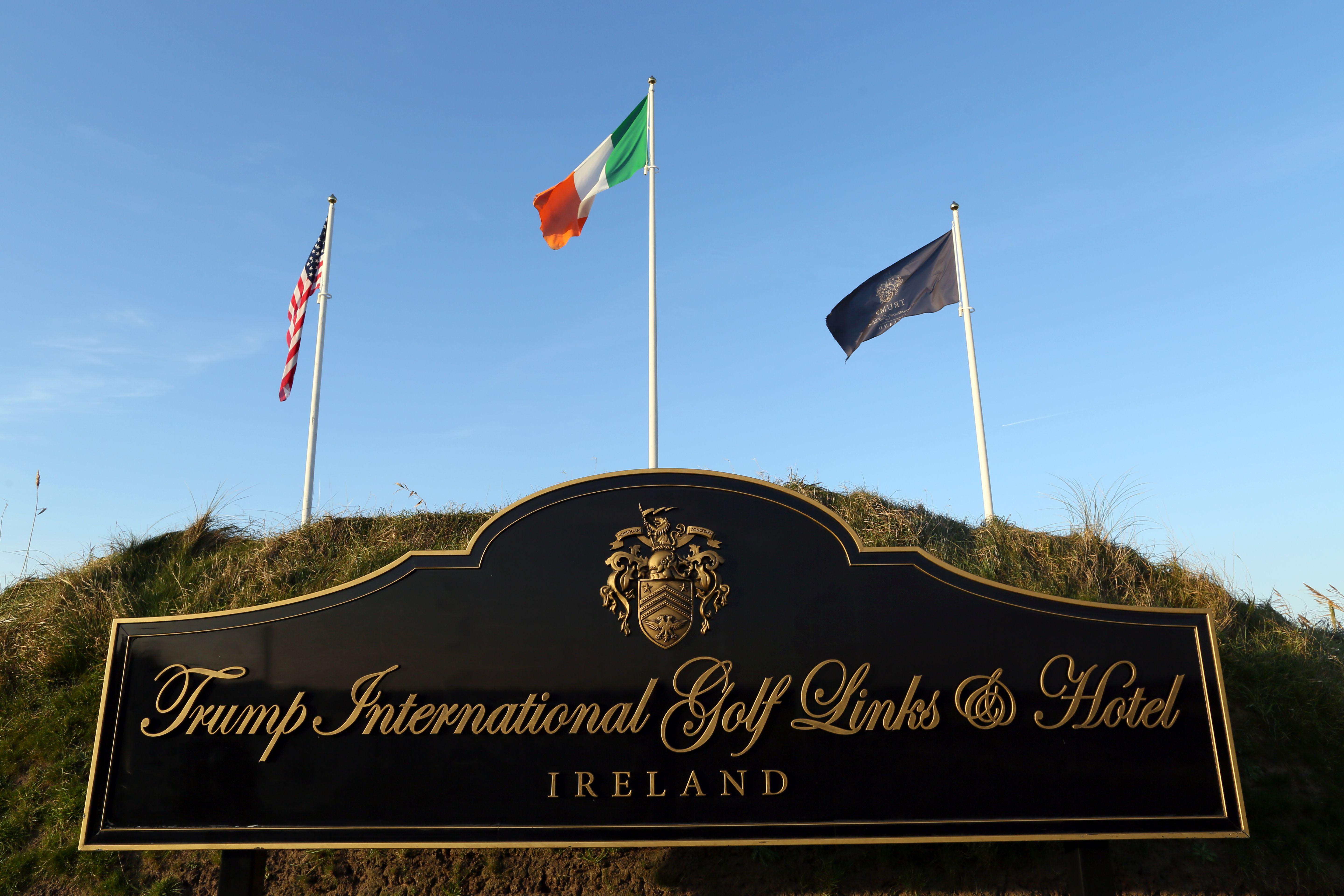 Flags fly outside the entrance to Trump International Golf Course, owned by US President-elect Donald Trump, near Doonbeg, on the west coast of Ireland, on December 2, 2016. 