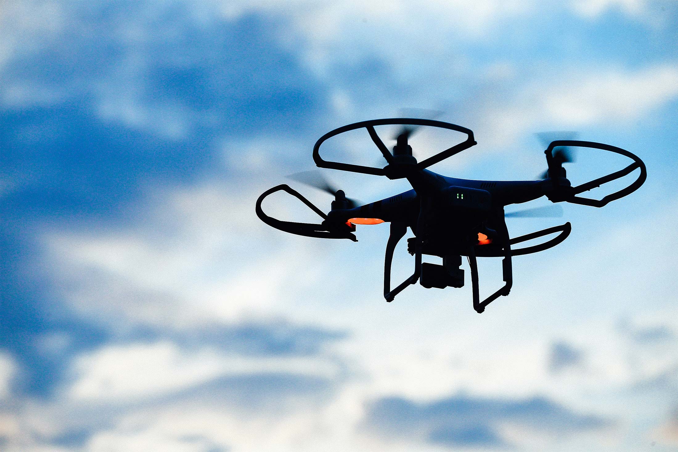 A drone is flown for recreational purposes in the sky above Old Bethpage, New York on August 30, 2015. 