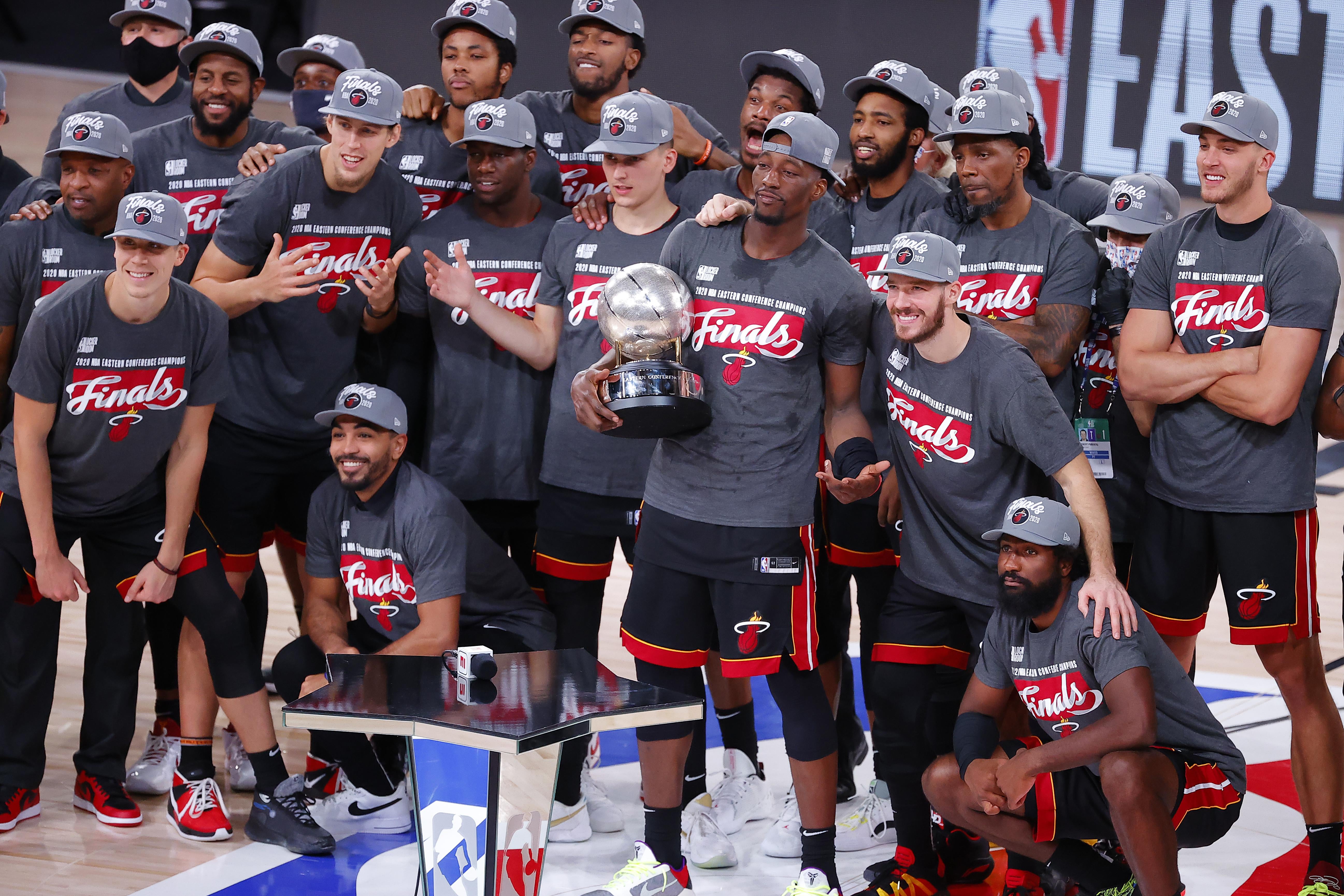 LAKE BUENA VISTA, FLORIDA - SEPTEMBER 27: The  Miami Heat celebrate with the trophy after they are Eastern Finals Champions against the Boston Celtics in Game Six of the Eastern Conference Finals during the 2020 NBA Playoffs at AdventHealth Arena at the ESPN Wide World Of Sports Complex on September 27, 2020 in Lake Buena Vista, Florida. NOTE TO USER: User expressly acknowledges and agrees that, by downloading and or using this photograph, User is consenting to the terms and conditions of the Getty Images License Agreement.  (Photo by Kevin C. Cox/Getty Images)