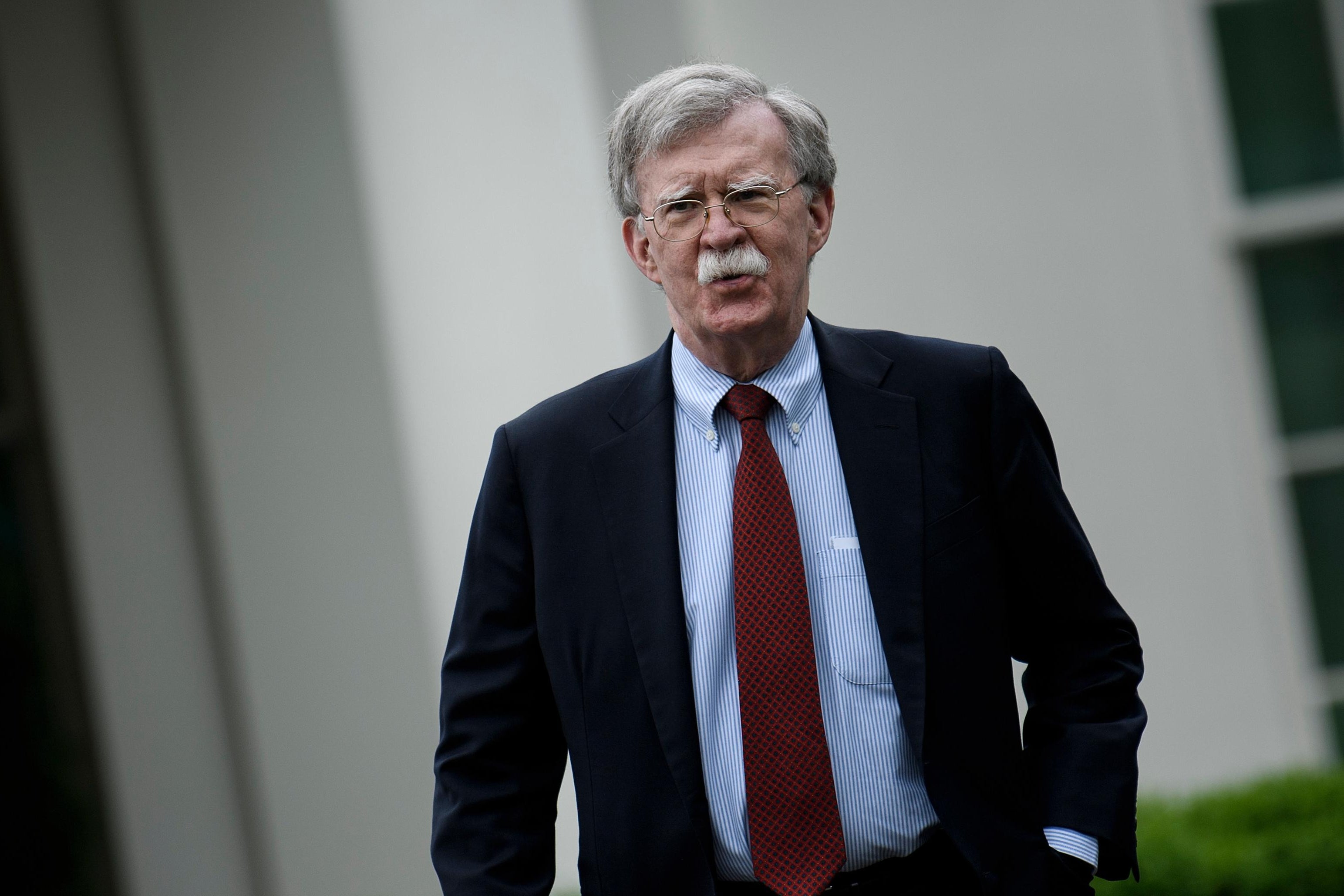 Bolton walking with his hand in his pocket