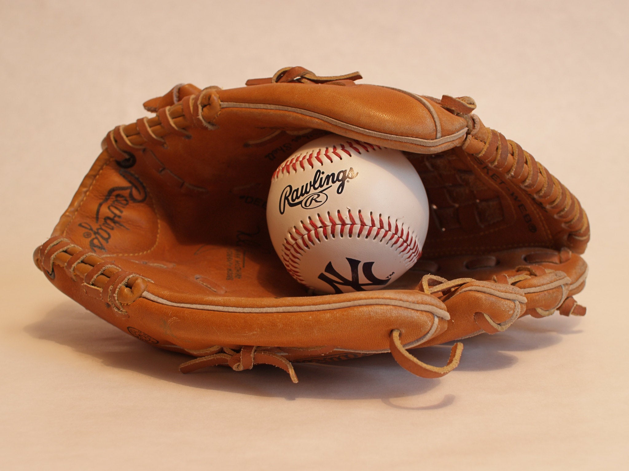 A baseball in a glove. 