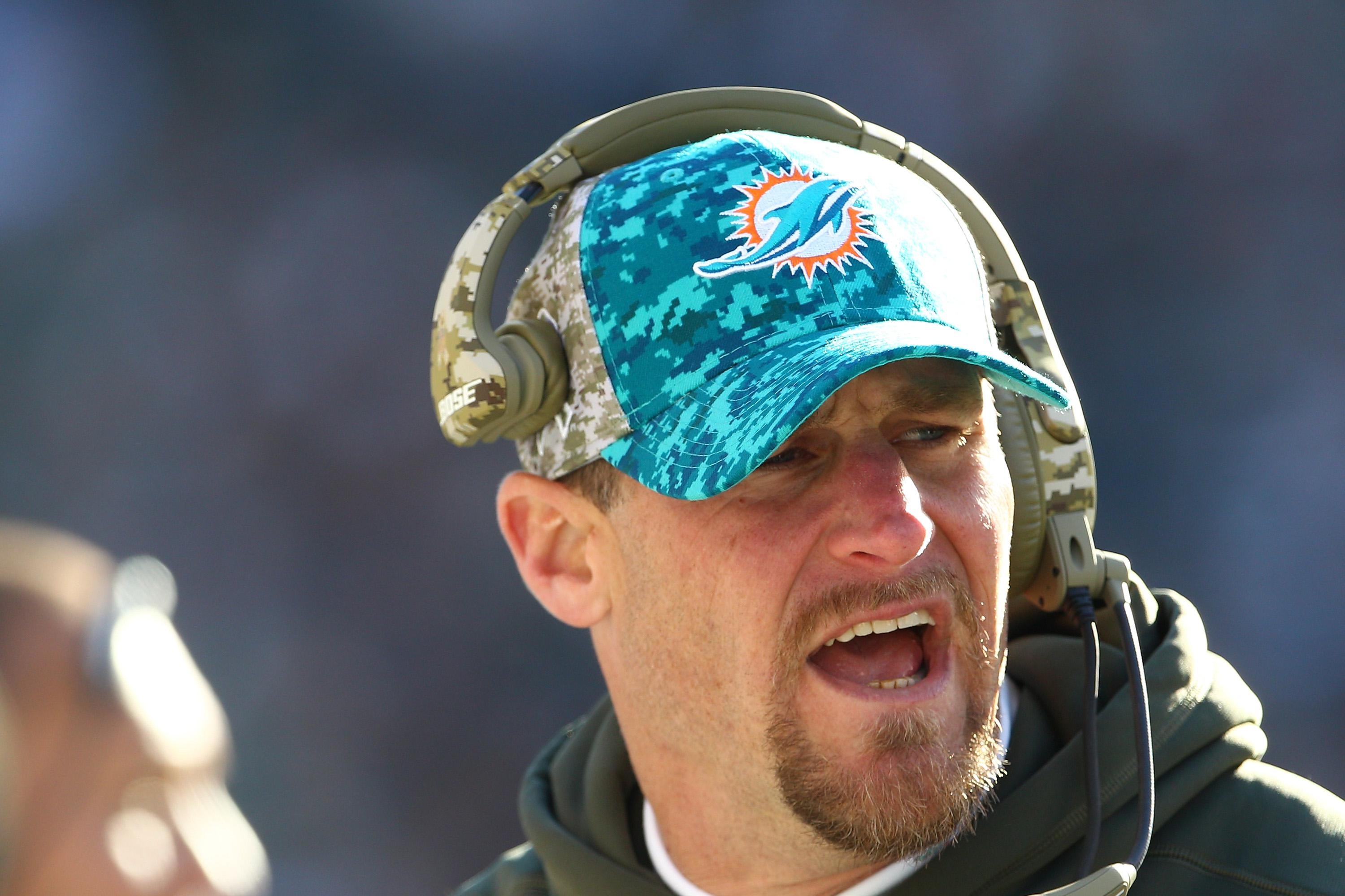 Campbell looks on during a Dolphins game, with his mouth open