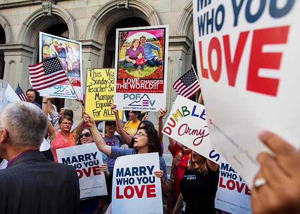 Same-sex marriage supporters hold a rally in front of the 4th U.S. Circuit Court of Appeals before a court hearing May 13, 2014 in Richmond, Virginia.