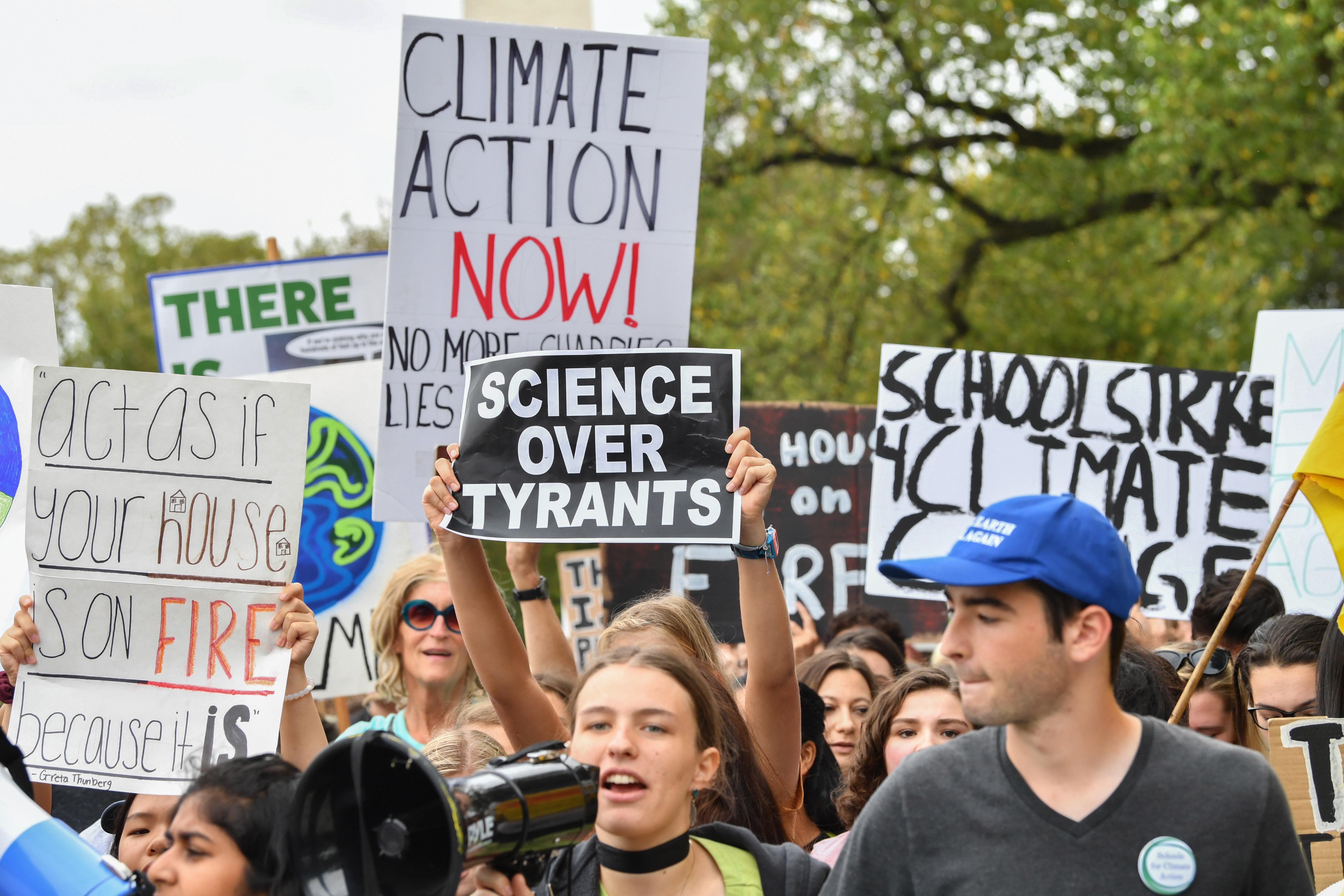 Teenagers and students take part in a climate protest outside the White House.