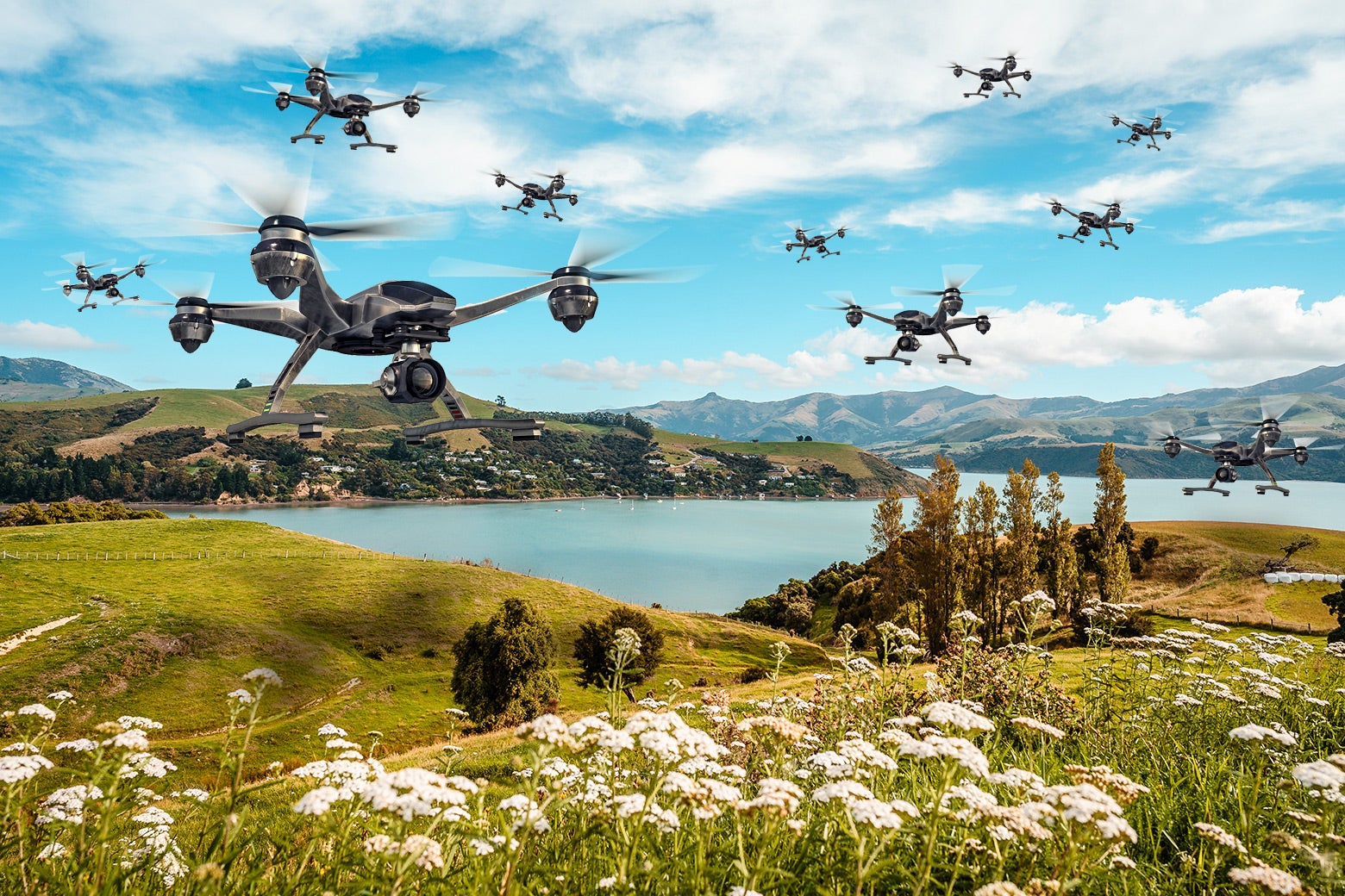 A beautiful New Zealand landscape, with drones hovering above it.