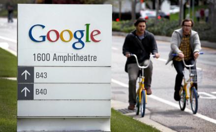 Google workers ride bikes outside of Google headquarters in Mountain View, Calif., April 12, 2012. 