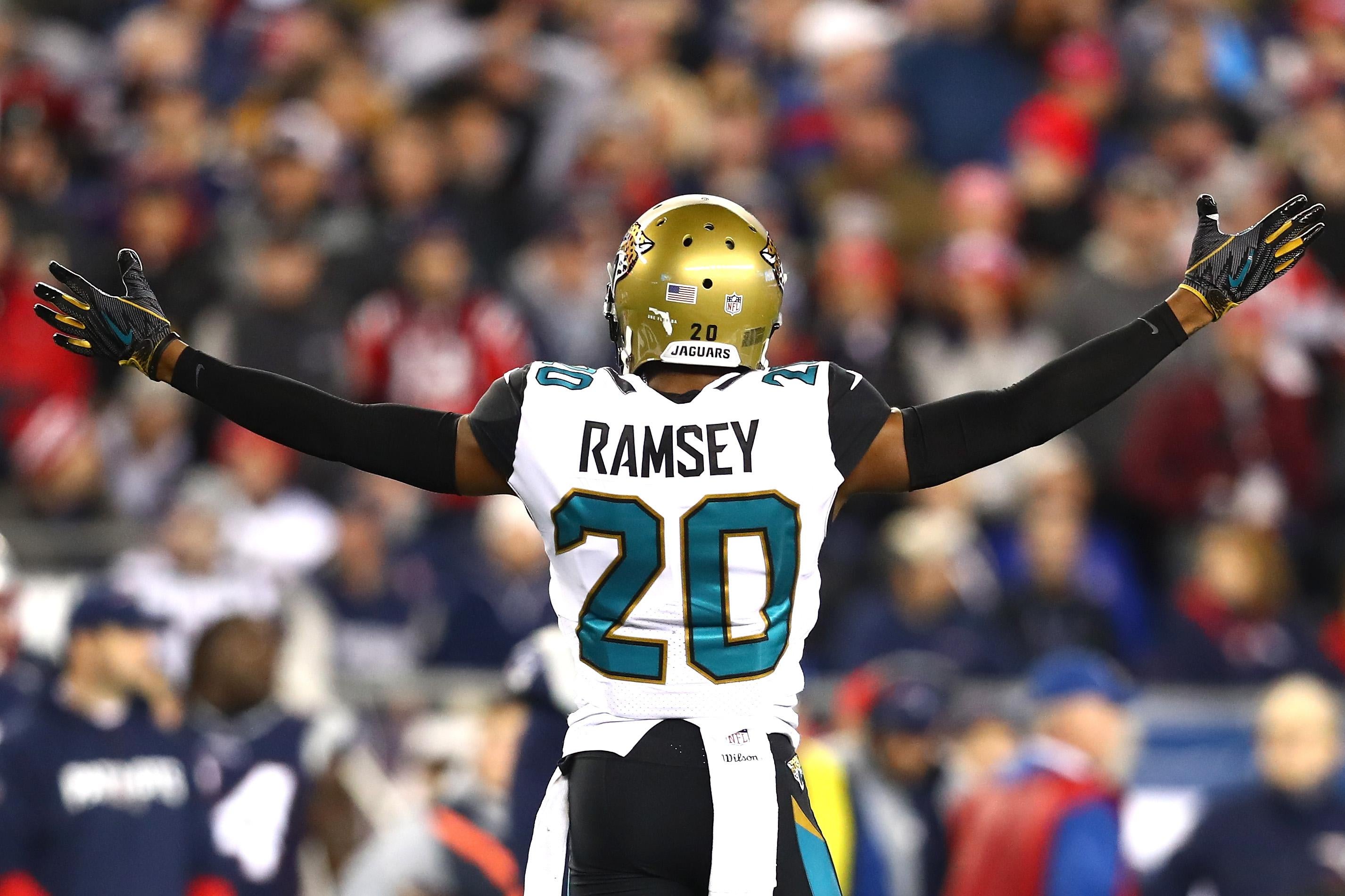 Jalen Ramsey of the Jacksonville Jaguars lifts his arms up, wide, during the AFC Championship Game against the New England Patriots on Jan. 21 in Foxborough, Massachusetts.