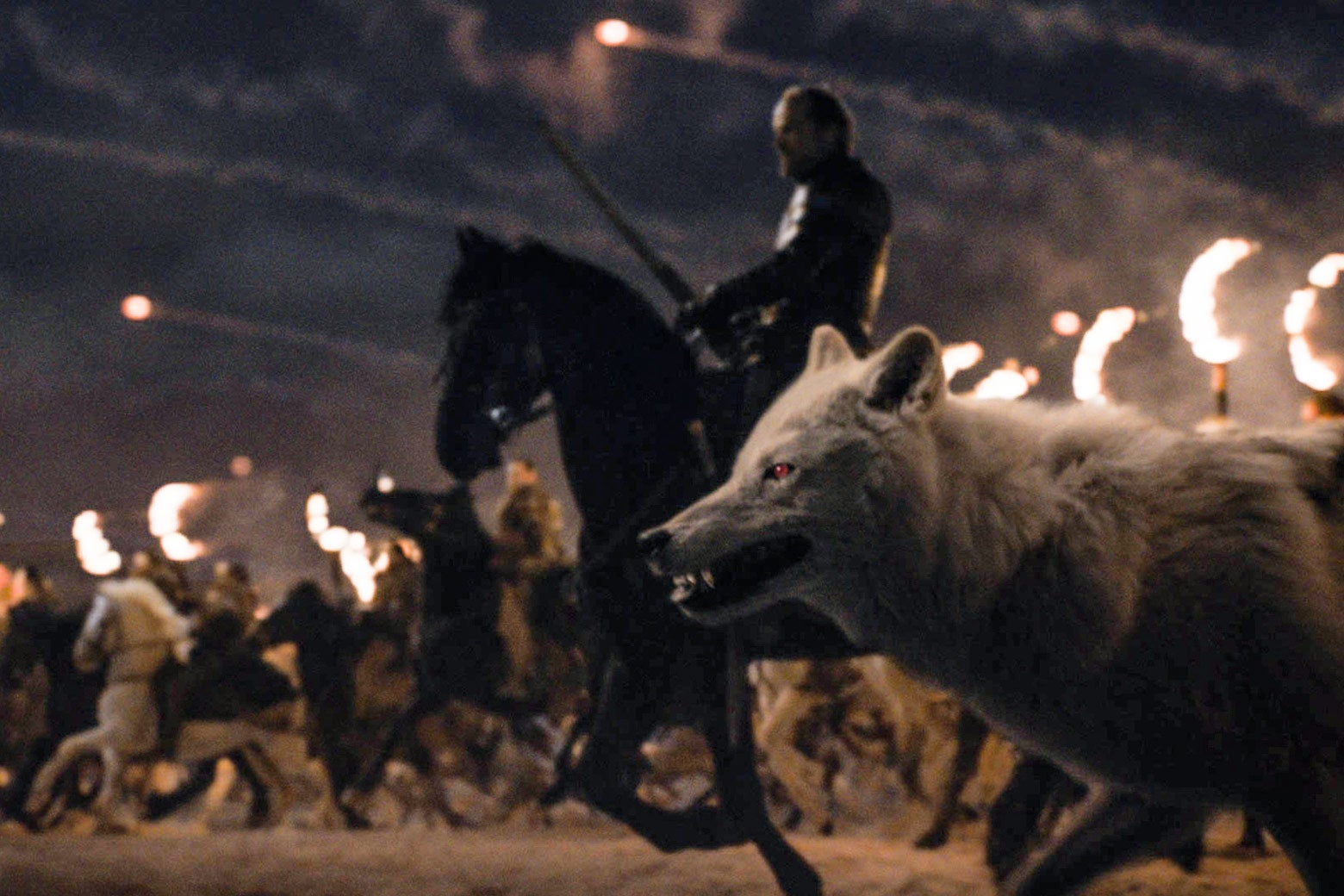 Jorah Mormont and Ghost ride into battle.