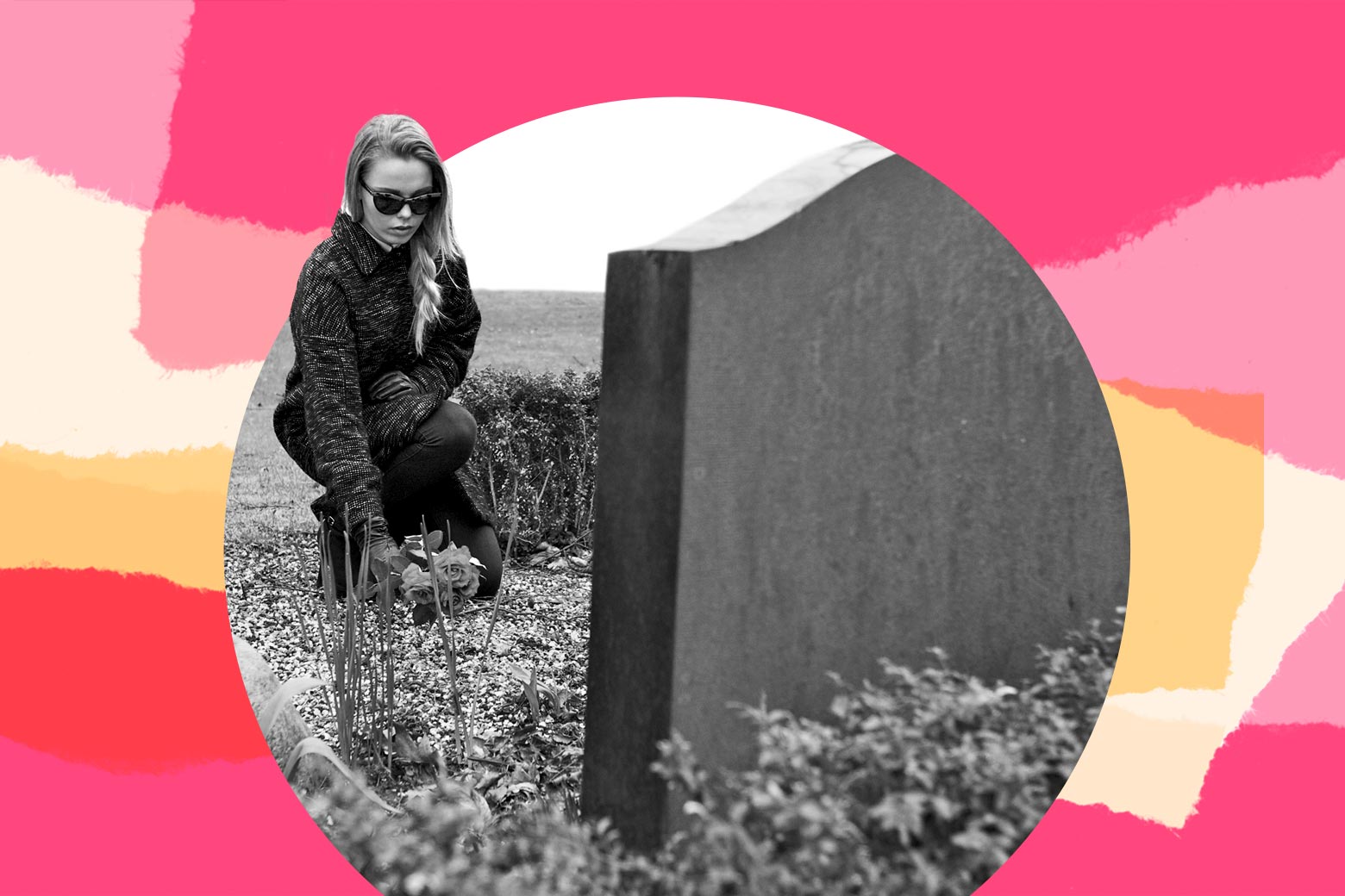 Woman dressed in black visiting a grave.